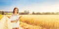 Beauty romantic girl enjoying nature in outdoors. Happy young woman in white shorts holding the ears on the road Royalty Free Stock Photo