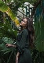 Beauty Romantic Girl Outdoor. Beautiful Teenage Model Dressed in Fashionable Green Dress Posing Outdoors in park Royalty Free Stock Photo