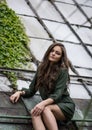 Beauty Romantic Girl Outdoor. Beautiful Teenage Model Dressed in Fashionable Green Dress Posing Outdoors Royalty Free Stock Photo