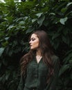 Beauty Romantic Girl Outdoor. Beautiful Teenage Model Dressed in Fashionable Green Dress Posing Outdoors in park. Toned in warm co Royalty Free Stock Photo