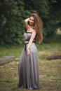 Beauty Romantic Girl Outdoors. Teenage Model with Casual Dress in park. Blowing Long Hair. Royalty Free Stock Photo