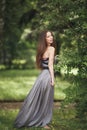 Beauty Romantic Girl Outdoors. Teenage Model with Casual Dress in park. Blowing Long Hair. Royalty Free Stock Photo