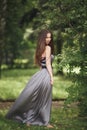 Beauty Romantic Girl Outdoors. Teenage Model with Casual Dress in park. Blowing Long Hair. Royalty Free Stock Photo