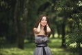 Beauty Romantic Girl Outdoors. Teenage Model with Casual Dress in park. Blowing Long Hair. Royalty Free Stock Photo