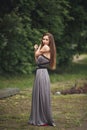 Beauty Romantic Girl Outdoors. Teenage Model with Casual Dress in park. Blowing Long Hair. Royalty Free Stock Photo