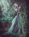 Beauty romantic model girl fashion posing in garden trees, enjoying nature in apple orchard. Beautiful brunette young woma Royalty Free Stock Photo