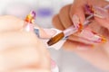 Beauty salon: Manicure, painting on nail Royalty Free Stock Photo