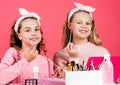 Beauty salon. Sisterhood happiness. Skin care. Kids makeup. Beauty and fashion. Happy girls doing makeup. Sisters play Royalty Free Stock Photo