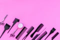 Beauty saloon equipment. Hairdress, haircut. Combs, sciccors, brushes on pink background top view copy space