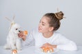 Beauty sexy woman with dog eating sushi. Sushi rolls. Fashion model girl eating Sushi with chopsticks. Perfect make up Royalty Free Stock Photo