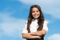 Beauty shines. Happy child smile with confidence on sunny sky. Little girl wear long wavy hairstyle. Beauty and hair