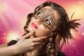 Beauty shoot of smart brunette woman in carnival mask