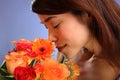 Beauty shot young Japanese girl smelling flowers Royalty Free Stock Photo