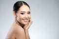 Beauty shot of young pretty asian woman with clear skin ongrey b