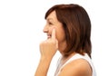 Profile of senior woman pointing to eye wrinkles Royalty Free Stock Photo