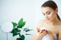 Beauty Skin Care. Beautiful Woman Applying Cosmetic Face Cream Royalty Free Stock Photo
