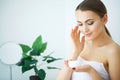 Beauty Skin Care. Beautiful Woman Applying Cosmetic Face Cream Royalty Free Stock Photo