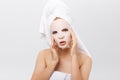 Beauty Skin Care Concept - Beautiful Caucasian Woman applying paper sheet mask on her face white background. Royalty Free Stock Photo