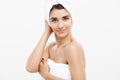 Beauty and Skin care concept - Beautiful caucasian Young Woman with bath towel on head covering her breasts, on white. Royalty Free Stock Photo