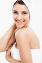 Beauty and Skin care concept - Beautiful caucasian Young Woman with bath towel on head covering her breasts, on white Royalty Free Stock Photo