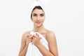 Beauty and Skin care concept - Beautiful caucasian Young Woman with bath towel on head covering her breasts, on white Royalty Free Stock Photo