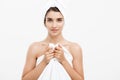 Beauty and Skin care concept - Beautiful caucasian Young Woman with bath towel on head covering her breasts, on white Royalty Free Stock Photo