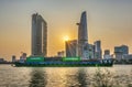 Beauty skyscrapers along urban river down smooth light when export transport ship passing