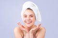 Beauty smiling woman with clean healthy natural skin. Portrait of attractive young girl with a bath towel on head Royalty Free Stock Photo