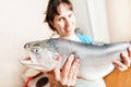 Beauty Smiling Woman Holding Raw Salmon Or Trout Fish Food