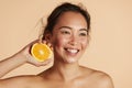 Beauty. Smiling woman with radiant face skin and orange portrait Royalty Free Stock Photo
