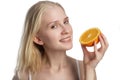 Beauty. Smiling woman with radiant face skin and orange portrait. Vitamin C cosmetics concept Royalty Free Stock Photo