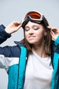 Beauty sport girl. Snowboard jacket. Pretty young woman in fitness clothes Royalty Free Stock Photo