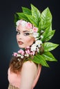 Beauty Spring girl with flowers hair. Beautiful model woman with flowers on her head. The Nature Of Hairstyle. Summer Royalty Free Stock Photo