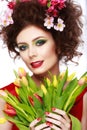 Beauty Spring Girl with Flowers Hair Style. Beautiful Model woman with Blooming flowers on her head. Nature Hairstyle. Summer. Ho Royalty Free Stock Photo