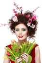 Beauty Spring Girl with Flowers Hair Style. Beautiful Model woman with Blooming flowers on her head. Nature Hairstyle. Summer. Ho Royalty Free Stock Photo