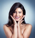 Beauty is a state of mind. Studio shot of a beautiful young woman posing against a blue background.