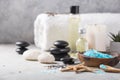 SPA concept: composition of spa treatment with natural sea salt, aromatic oil and flowers on wooden background, close up, top view Royalty Free Stock Photo