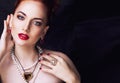 Beauty stylish redhead woman with hairstyle and manicure wearing