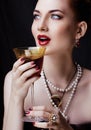 Beauty stylish redhead woman with hairstyle and manicure wearing jewelry pearl close up Royalty Free Stock Photo