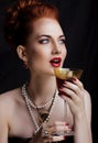 Beauty stylish redhead woman with hairstyle and manicure wearing jewelry pearl close up Royalty Free Stock Photo