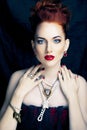 Beauty stylish redhead woman with hairstyle and manicure wearing jewelry pearl close up Royalty Free Stock Photo