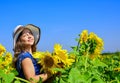 Beauty of summer nature. little girl in sunflower field. yellow flower of sunflower. happy childhood. beautiful girl Royalty Free Stock Photo