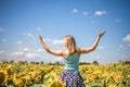 Beauty sunlit woman on yellow sunflower field Freedom and happiness concept. Happy girl outdoors Royalty Free Stock Photo