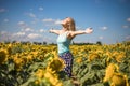 Beauty sunlit woman on yellow sunflower field Freedom and happiness concept. Happy girl outdoors Royalty Free Stock Photo