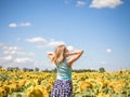 Beauty sunlit woman on yellow sunflower field Freedom and happiness concept. Happy girl outdoors Royalty Free Stock Photo