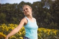 Beauty sunlit woman on yellow sunflower field Freedom and happiness concept. Happy girl outdoors Royalty Free Stock Photo