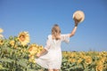 Beauty sunlit woman on yellow sunflower field Freedom and happiness concept. Happy girl outdoors Royalty Free Stock Photo