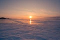 Beauty of sunset over snow covered freeze water lake, Baikal Russia Royalty Free Stock Photo