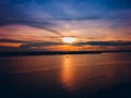 the beauty of the sunset and the silhouette of the boat in the middle of the river