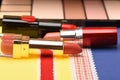 Beauty supplies, lipstick, beige palette, powder, rouge, concealer.